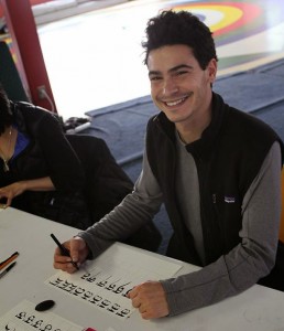 Student practicing letters