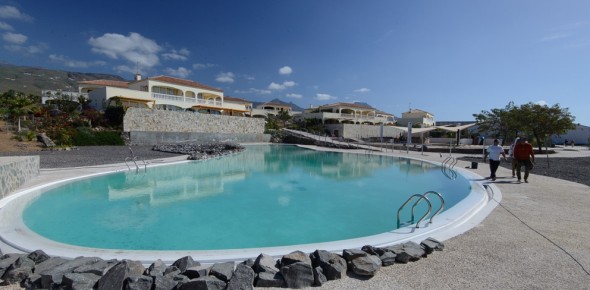 Completed pool with Rinpoche's home behind