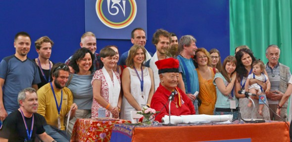 Rinpoche wearing a traditional hat from Krakow and practitioners from there. Photo Artur Zolkowski