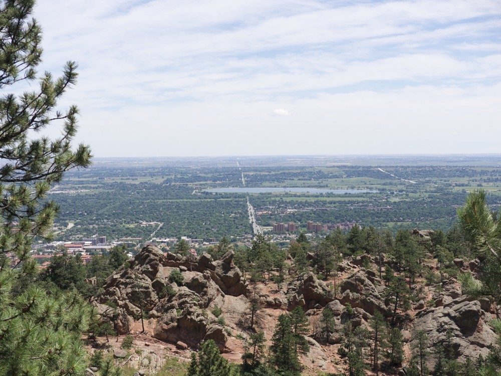 Scenic view of Boulder and Colorado University and view stretching to the east and Denver below - from Flagstaff Mountain high above Boulder: elevation 6000 ft above sea level