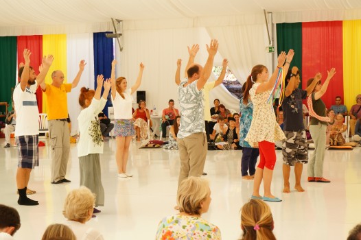 Teaching a dance to volunteers from the audience. Photo Mila Marchulenete