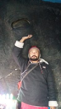 Cvetco pointing to Padmasambhava's footprint