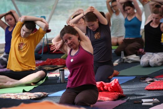 Participants doing yoga at the haromious breathing kunsangar