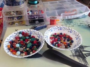 two bowls containing beads for evolution creations