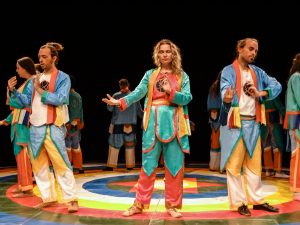 Dancers performing the Dance of the Vajra that Benefits Beings in costumes