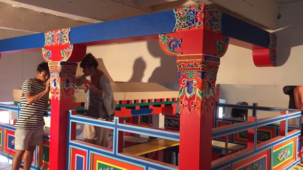Applying the decorations at the Museum