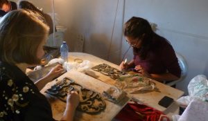 Working on the clay designs