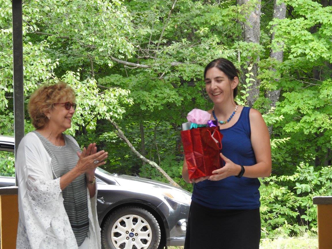 Project Manager Sarale receiving thanks and gift from Yellow Gakyil member Diane Kramer